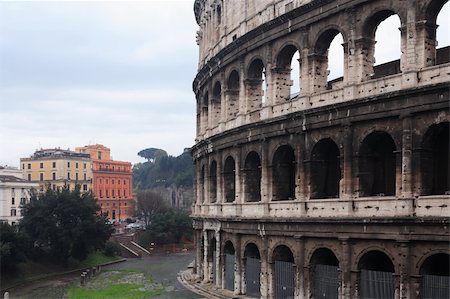 simsearch:400-06064727,k - Winter in Rome. Closeup of Coliseum on background with colored buildings Foto de stock - Super Valor sin royalties y Suscripción, Código: 400-05903782