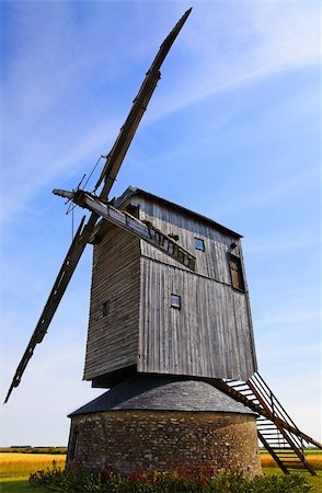 simsearch:400-06101286,k - Traditional wooden windmill in France in the Eure &Loir Valley region.This is "moulin Barbier" mill.The image is intentionally deformated a little. Stock Photo - Budget Royalty-Free & Subscription, Code: 400-05903844