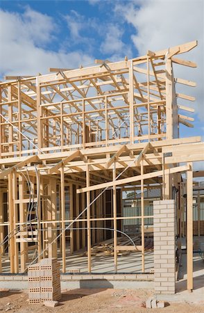 simsearch:400-05344387,k - Fragment of a new residential construction home framing against a blue sky. Stock Photo - Budget Royalty-Free & Subscription, Code: 400-05903921