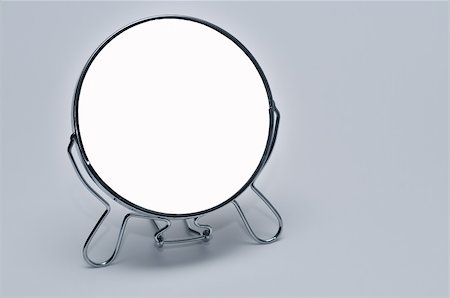 Round make up mirror with copyspace in center Stock Photo - Budget Royalty-Free & Subscription, Code: 400-05914586