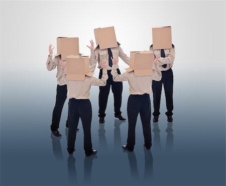 Brain storming businessmen with cardboard box heads Stock Photo - Budget Royalty-Free & Subscription, Code: 400-05914599