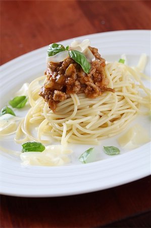 simsearch:400-06686774,k - Spaghetti with bolognese sauce, cheese and basil Stock Photo - Budget Royalty-Free & Subscription, Code: 400-05915229