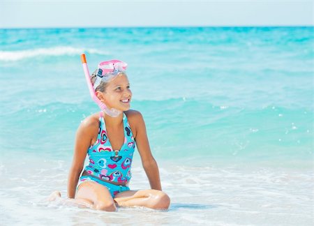 Portrait of a cute girl wearing a mask for diving background of the sea Stock Photo - Budget Royalty-Free & Subscription, Code: 400-05915239