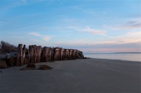 south carolina landscape - Weathered wooden fence barrier and rocks protecting the coastline during sunset. Near Charleston, South Carolina. Stock Photo - Budget Royalty-Free & Subscription, Code: 400-05915254