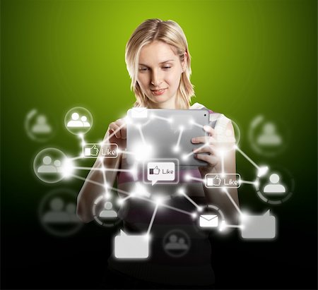 social media likes - Woman businesswoman in suit with touch pad in his hands Stock Photo - Budget Royalty-Free & Subscription, Code: 400-05915563