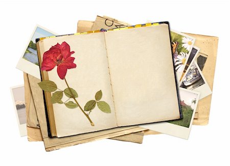 Old book and photos. Objects isolated over white Stock Photo - Budget Royalty-Free & Subscription, Code: 400-05917168