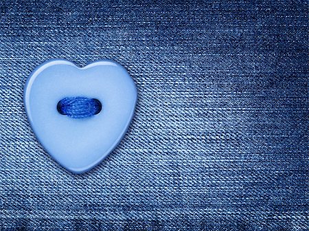 Blue heart shape button, sewed on a denim jeans cloth Stock Photo - Budget Royalty-Free & Subscription, Code: 400-05917239