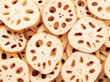 close up of sliced lotus root food background Foto de stock - Super Valor sin royalties y Suscripción, Código: 400-05917421