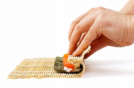 sushi preparation, bamboo mat and sushi maki roll Stock Photo - Budget Royalty-Free & Subscription, Code: 400-05918049
