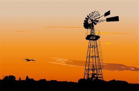 Silhouette of a vintage water pumping windmill against sunset sky Foto de stock - Royalty-Free Super Valor e Assinatura, Número: 400-05918399