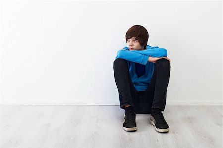 The times when every thought is big - serious teenager boy sitting Fotografie stock - Microstock e Abbonamento, Codice: 400-05919472