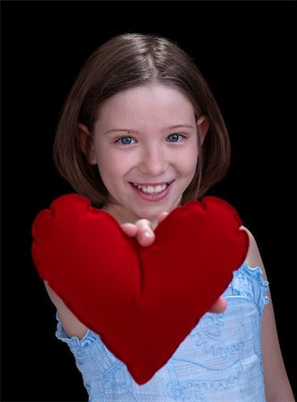 First love concept - young girl holding red heart Foto de stock - Super Valor sin royalties y Suscripción, Código: 400-05919506