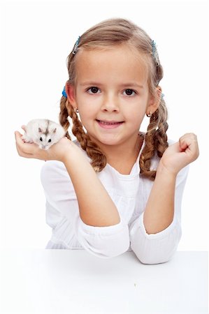 Here is my hamster - little girl with her pet Stock Photo - Budget Royalty-Free & Subscription, Code: 400-05919524