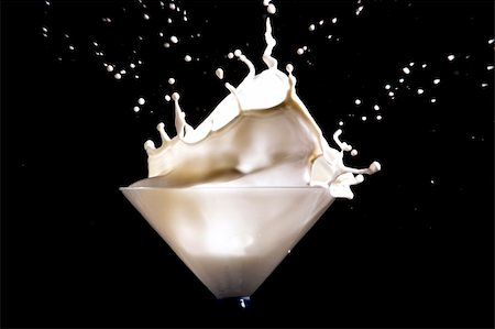 white milk splash on black background Stock Photo - Budget Royalty-Free & Subscription, Code: 400-05910325