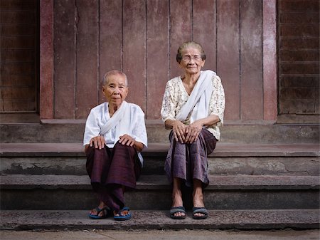 Portrait of two old asian women sitting on steps out of their house and looking at camera Stock Photo - Budget Royalty-Free & Subscription, Code: 400-05910402