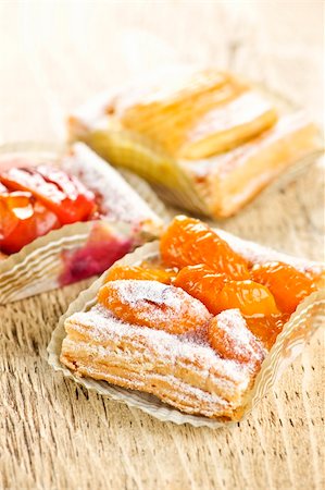 peach slice - Closeup on slices of flaky fruit strudel desserts Stock Photo - Budget Royalty-Free & Subscription, Code: 400-05910782