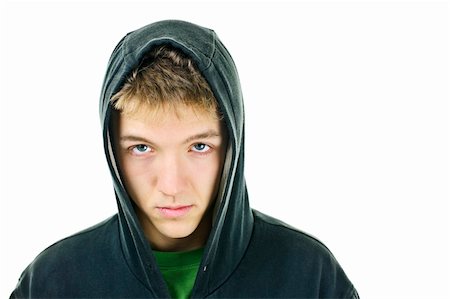 Young man with attitude wearing hoodie isolated on white background Foto de stock - Super Valor sin royalties y Suscripción, Código: 400-05910820