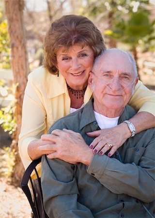Senior Woman Outside with Seated Man Wearing Oxygen Tubes. Stock Photo - Budget Royalty-Free & Subscription, Code: 400-05910918