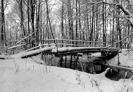 Winter landscape with small river and footpath bridge. Stockbilder - Microstock & Abonnement, Bildnummer: 400-05911273