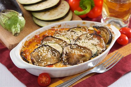 aubergine  bake with courgette, pumpkin and tomatoes Stock Photo - Budget Royalty-Free & Subscription, Code: 400-05911304