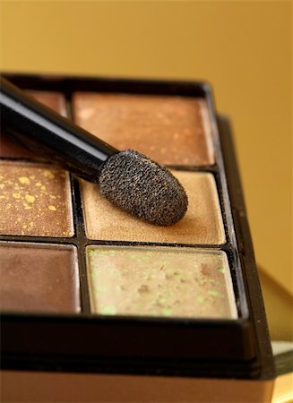 gold eyeshadow palette with a brush Stock Photo - Budget Royalty-Free & Subscription, Code: 400-05911556