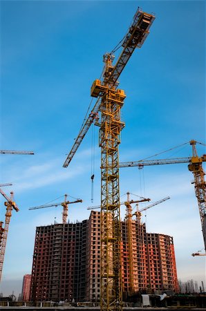 simsearch:400-05074551,k - Crane stays in front of the new, constructing building Foto de stock - Royalty-Free Super Valor e Assinatura, Número: 400-05911777