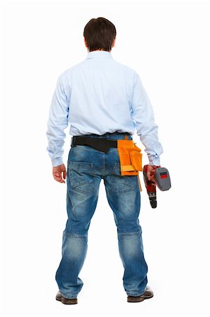 Full length portrait of construction worker standing back to camera Stock Photo - Budget Royalty-Free & Subscription, Code: 400-05911826