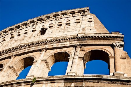 round amphitheatre - Colosseum in Rome with blue sky, landmark of the city Stock Photo - Budget Royalty-Free & Subscription, Code: 400-05912034