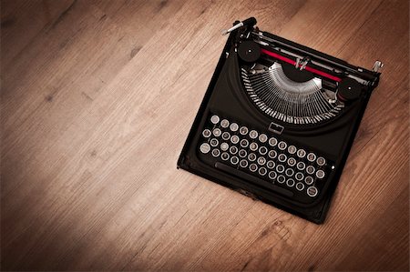 Top view of a vintage typewriter over a wood floor Stock Photo - Budget Royalty-Free & Subscription, Code: 400-05912323