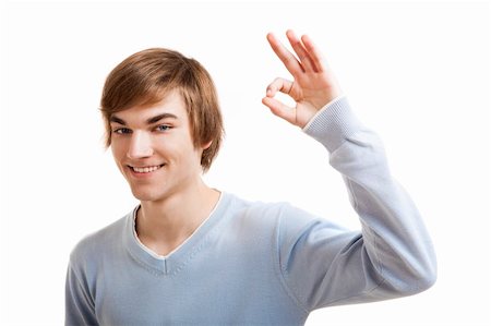 simsearch:400-05912376,k - Portrait of a handsome young man doing a Okay gesture, isolated over a white background Foto de stock - Super Valor sin royalties y Suscripción, Código: 400-05912381