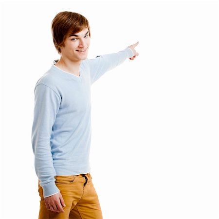 Young man showing something and pointing, isolated on white background Stock Photo - Budget Royalty-Free & Subscription, Code: 400-05912396
