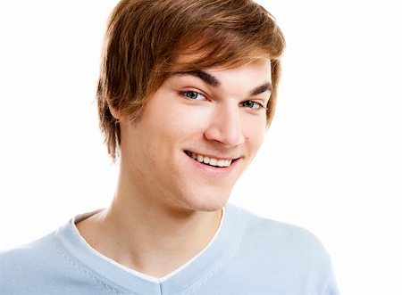 Portrait of a handsome young man smiling to the camera, isolated over a white background Stock Photo - Budget Royalty-Free & Subscription, Code: 400-05912392