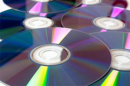 simsearch:400-03950272,k - Background of Many Shiny CD Compact Discs Photographie de stock - Aubaine LD & Abonnement, Code: 400-05925736