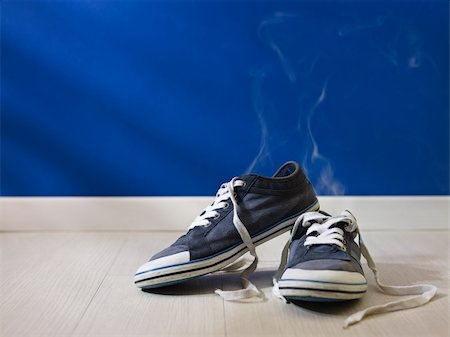 smoking room - concept shot of feet perspiration: bad smell coming out from old and dirty shoes Stock Photo - Budget Royalty-Free & Subscription, Code: 400-05927737