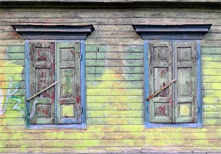 Old house, sun-blind. Broken paint layers. Colored, wooden wall Photographie de stock - Aubaine LD & Abonnement, Code: 400-05927782