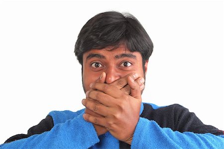 dramatic hands - Young south indian youth holding his mouth with hands showing facial expression of disbelief or surprise Stock Photo - Budget Royalty-Free & Subscription, Code: 400-05920159