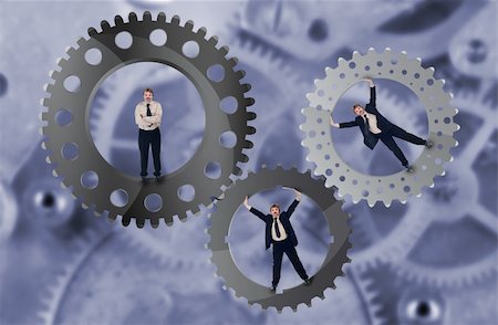 Teamwork and team effort concept with businessman and cogwheels Stock Photo - Budget Royalty-Free & Subscription, Code: 400-05920749