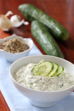 Tzatziki - Greek yogurt sauce with cucumbers, dill and garlic, known as tarator or snezhanka in Bulgaria or zaziki in Turkey. Shallow DOF Stock Photo - Budget Royalty-Free & Subscription, Code: 400-05920873