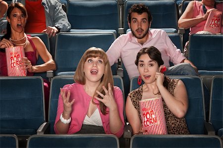 Group of amazed people watch movie in theater Stock Photo - Budget Royalty-Free & Subscription, Code: 400-05920987