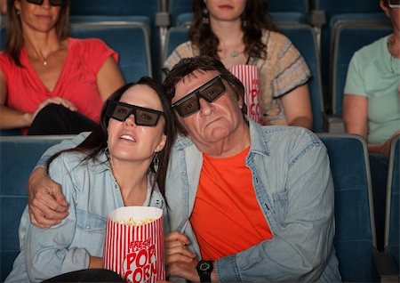 Loving couple in movie theater with 3D glasses Stock Photo - Budget Royalty-Free & Subscription, Code: 400-05920991