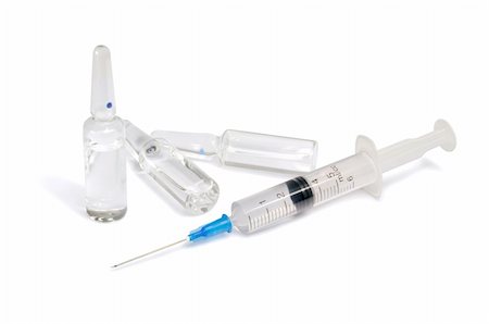 Single use syringe and vaccine against white background Foto de stock - Super Valor sin royalties y Suscripción, Código: 400-05923862