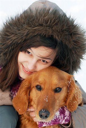 emotional golden retriever - smiling teenager caucasian girl in hood hugging her dog outdoors Stock Photo - Budget Royalty-Free & Subscription, Code: 400-05939215