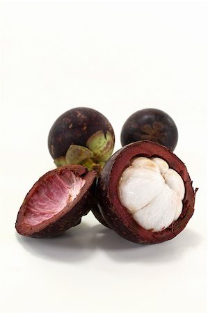fresh cut mangosteen on a light background Stock Photo - Budget Royalty-Free & Subscription, Code: 400-05946934
