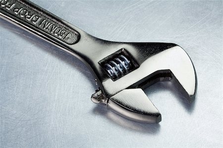 Spanner, wrench on a metal table Stock Photo - Budget Royalty-Free & Subscription, Code: 400-05947527