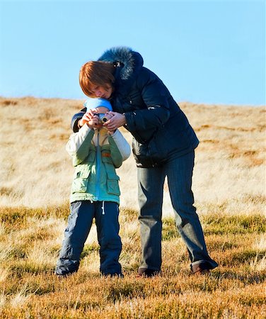 Family (mother with son) walk and make photo on autumn  mountain plateau Stock Photo - Budget Royalty-Free & Subscription, Code: 400-06064002