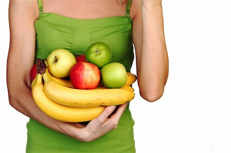pretty women eating banana - woman holds a pile of fruit on a white background Photographie de stock - Aubaine LD & Abonnement, Code: 400-06064821
