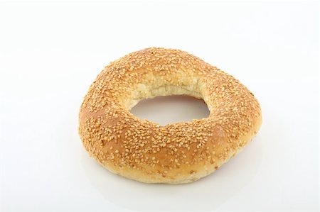 shapes of baking products - Close up of sesame bagel over white Stock Photo - Budget Royalty-Free & Subscription, Code: 400-06065169