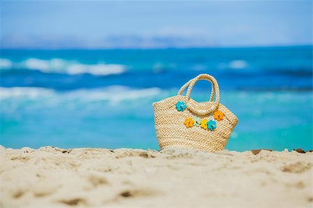 summer beach sea backgrounds - Photo of straw beach bag with flowers on exotic white sand beach Stock Photo - Budget Royalty-Free & Subscription, Code: 400-06065299