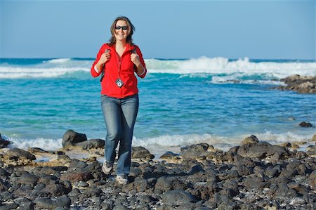 female glasses athlete - Sports young woman with backpack. In the background of the sea Stock Photo - Budget Royalty-Free & Subscription, Code: 400-06065328