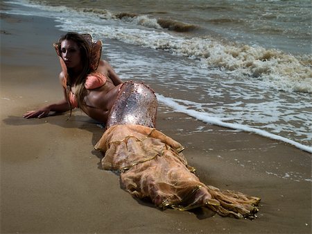 fantasy fish art - The girl in the image of a mermaid lying on the beach Stock Photo - Budget Royalty-Free & Subscription, Code: 400-06065381